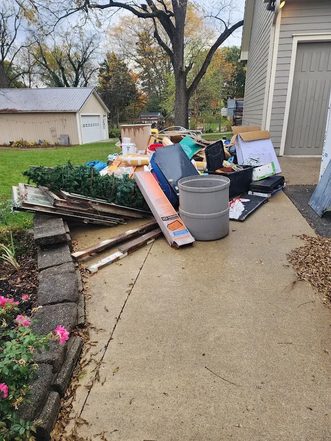 Dumpster being loaded with debris for Roofing Dumpster Rental in Texas City